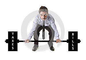 Corporate composite of young attractive businessman power lifting heavy weights taxes and bills
