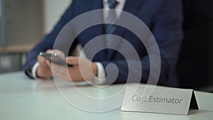 Corporate cost estimator using mobile phone for communication with investors