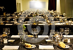 Corporate Dinner Party, Lighted Candles, White Napkins, Corn Bread, Elegant Table Set