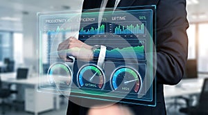 Business executive using high tech virtual touchscreen with icons for security, scheduling, and financial analysis.
