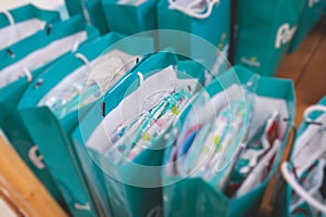 Corporate gifts and souvenirs for employees of the company, gift bag package for conference participants before start, process of