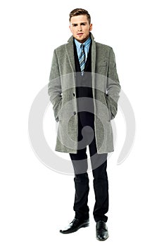 Corporate guy wearing long overcoat