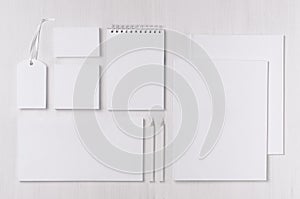 Corporate identity template with black white paper stationery set on soft white elegance wood board.