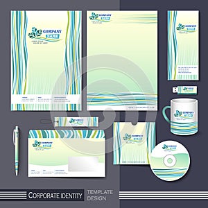 Corporate identity template with green and blue elements.