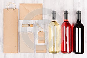 Corporate identity template for wine industry, blank brown kraft packaging, stationery, merchandise set with bottles different wi