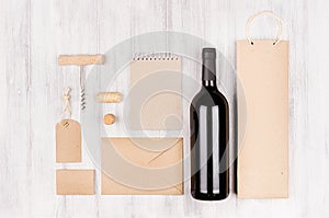 Corporate identity template for wine industry with bottle red wine on soft white wood background.