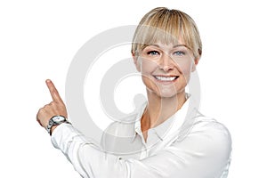 Corporate lady pointing backwards photo
