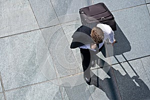 Corporate Man With Luggage And Costume Jacket