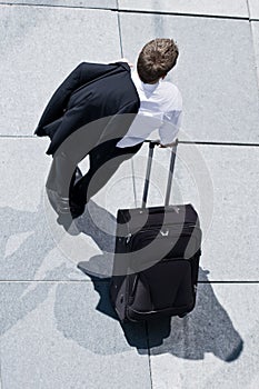 Corporate Man With Rolling Luggage