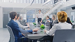 In the Corporate Meeting Room: Female Analyst Uses Digital Interactive Whiteboard for Presentation