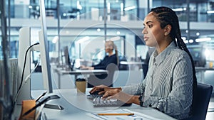 Corporate Office: Black Female IT Technician Using Desktop Computer, Uses Big Data Statistics, Gra