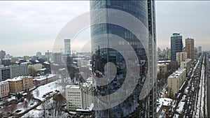 Corporate office building in winter city. Aerial view glass skyscraper