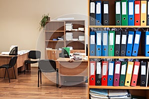 Corporate office room with storage of color folders as archive, nobody photo