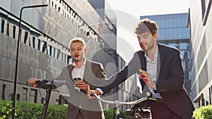 Corporate people commuting morning together. Two men discussing work project