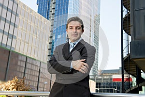 Corporate portrait attractive businessman standing outdoors urban office buildings