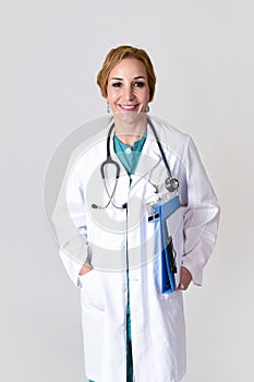 Corporate portrait of beautiful and happy woman md doctor or nurse posing smiling cheerful with stethoscope