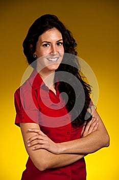 corporate portrait of a beautiful young hispanic woman with drak brown curly hair