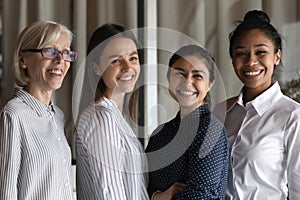 Corporate portrait of happy diverse confident female business team