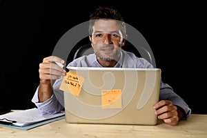 Corporate portrait happy successful businessman smiling at office desk working with laptop computer