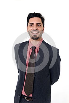Corporate portrait young attractive businessman of Hispanic ethnicity smiling in suit and tie