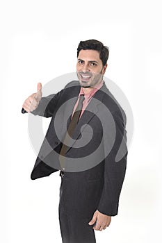 Corporate portrait of young attractive businessman of Latin Hispanic ethnicity giving thumb up