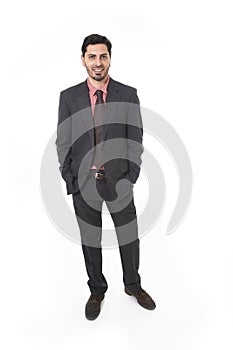 Corporate portrait of young attractive businessman of Latin Hispanic ethnicity smiling in suit and tie