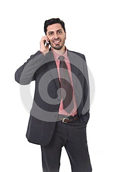 Corporate portrait of young attractive businessman of Latin Hispanic ethnicity talking on mobile phone