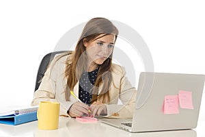 Corporate portrait young attractive businesswoman at office chair working at laptop computer desk