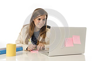 Corporate portrait young attractive businesswoman at office chair working at laptop computer desk