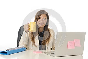 Corporate portrait young attractive businesswoman at office chair working at laptop computer desk