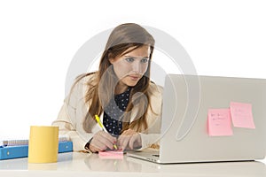 Corporate portrait young attractive businesswoman at office chair working at laptop computer desk