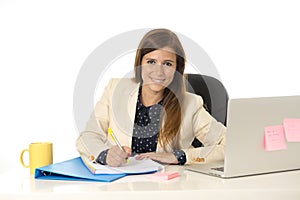 Corporate portrait young attractive businesswoman at office chair working at laptop computer desk