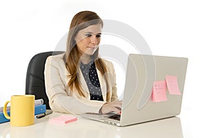 Corporate portrait young attractive businesswoman at office chair working at laptop computer desk