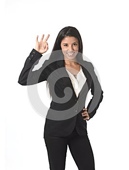 Corporate portrait of young attractive latin businesswoman in office suit smiling happy