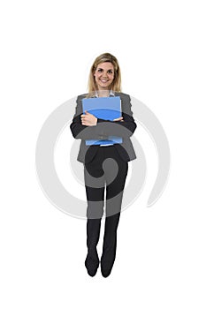 Corporate portrait young happy businesswoman holding folder posing confident smiling and relaxed