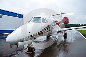 Corporate private jet parked at the airport. Business plane or commercial airplane