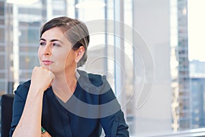 Corporate professional business woman in city office with buildings in background