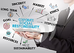 Corporate Social Responsibility Concept, young man holding a tab