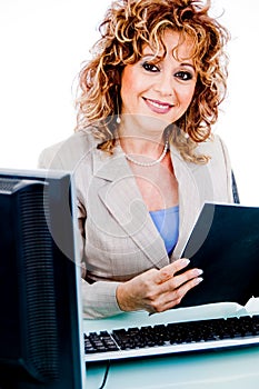 Corporate woman looking at file work