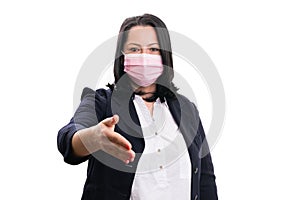 Corporate woman wearing medical mask offering handshake pandemic
