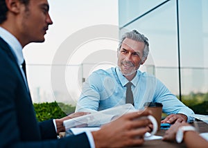 The corporates are delegating. corporate businessmen having a meeting outside.