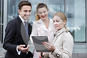 Corporation employees with tablet