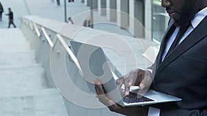 Corporation manager making final changes to report before presentation, business