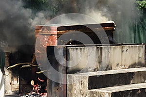 The corpse in the coffin is burning in the cremate, religious ri