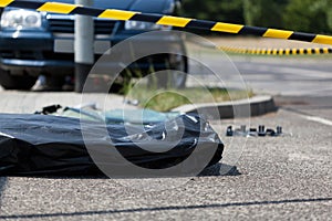 Corpse in plastic bag after car accident