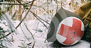 Corpsman Helmet Lies Near Fallen Soldier. Metal Helmet Of United States Army Infantry Medic Soldier At World War Ii. Re