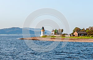 The Corran Point Lighthouse and Lodge on the Corran Narrows, in Loch Linnhe.