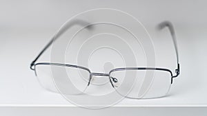 Corrective eyesight lenses. Close up of eyeglasses on the table.