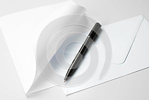 Correspondence Set: Blank Sheet of Paper with Curled Corner, Envelope and Pen