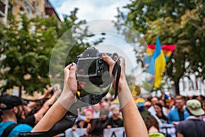 Correspondent takes photo during the Gay Pride parade